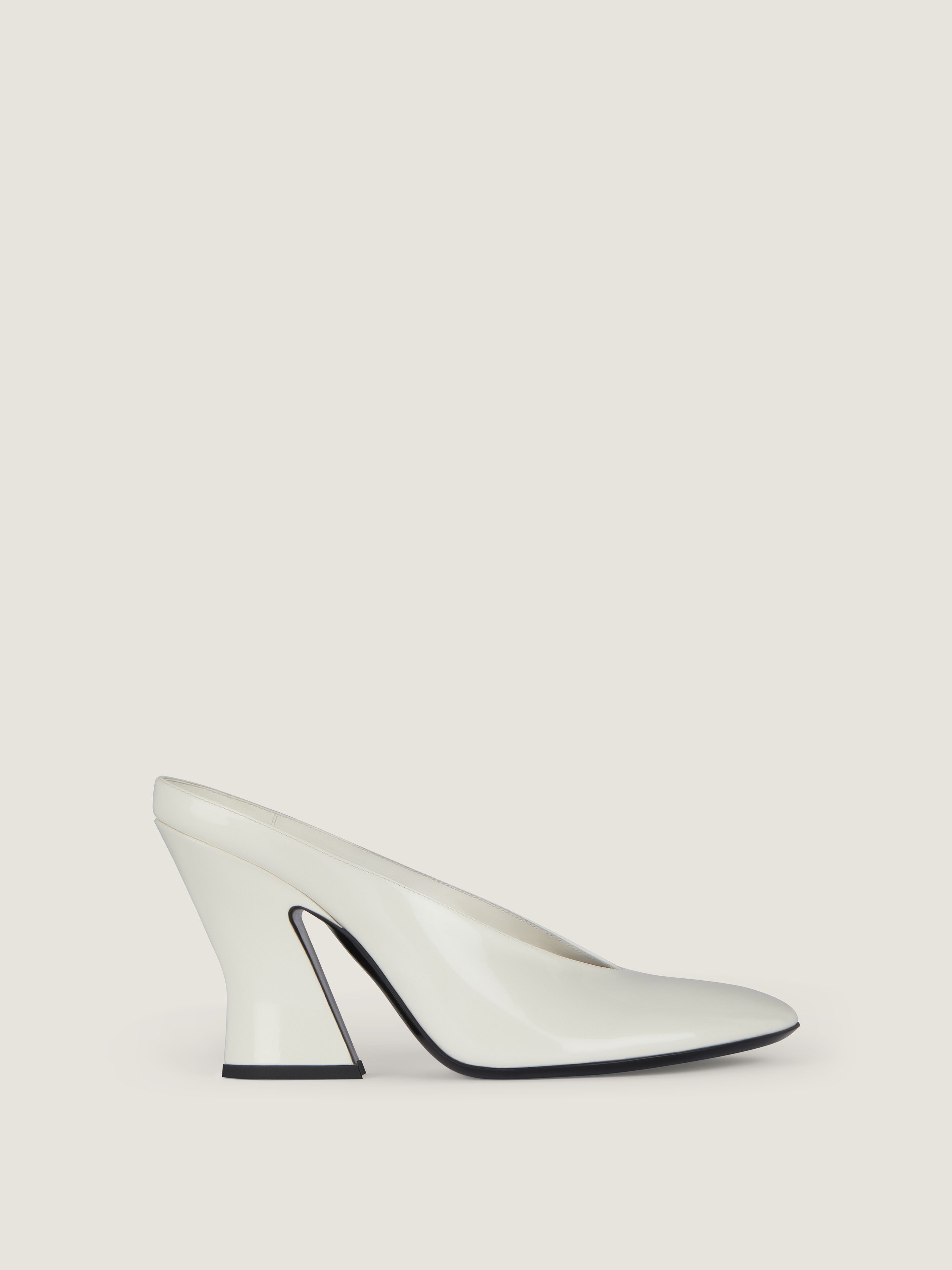 Sculpted heeled mules in patent leather